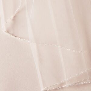 Ivory wedding bridal veil with delicate beaded trim fingertip length